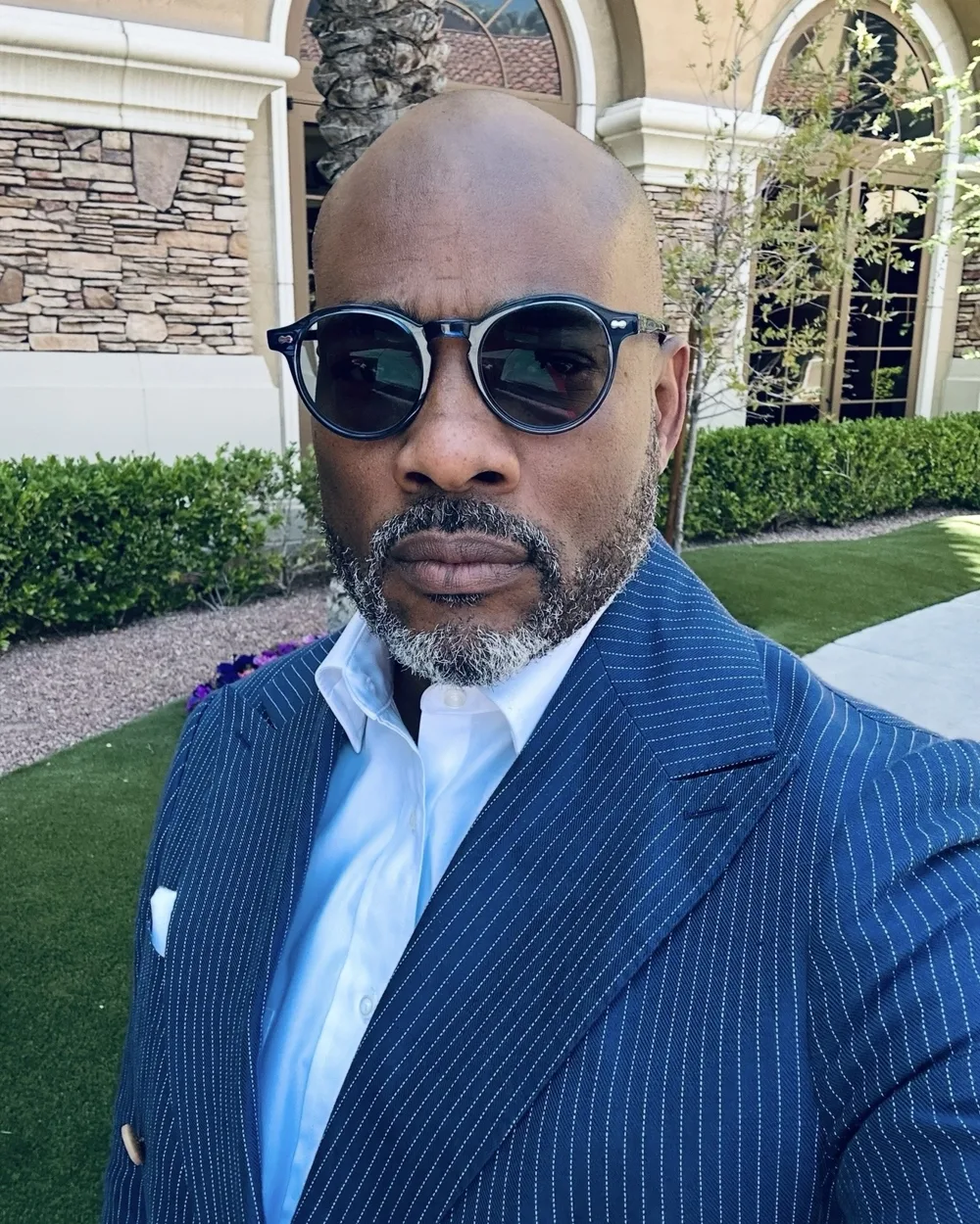 Portrait of StClare Rosenberg in a navy pinstripe suit